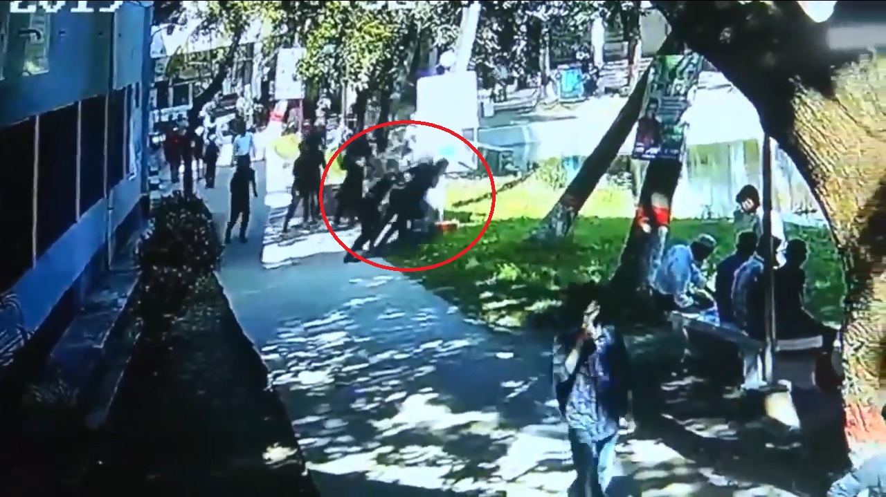 BCL activists  push principal  into a pond