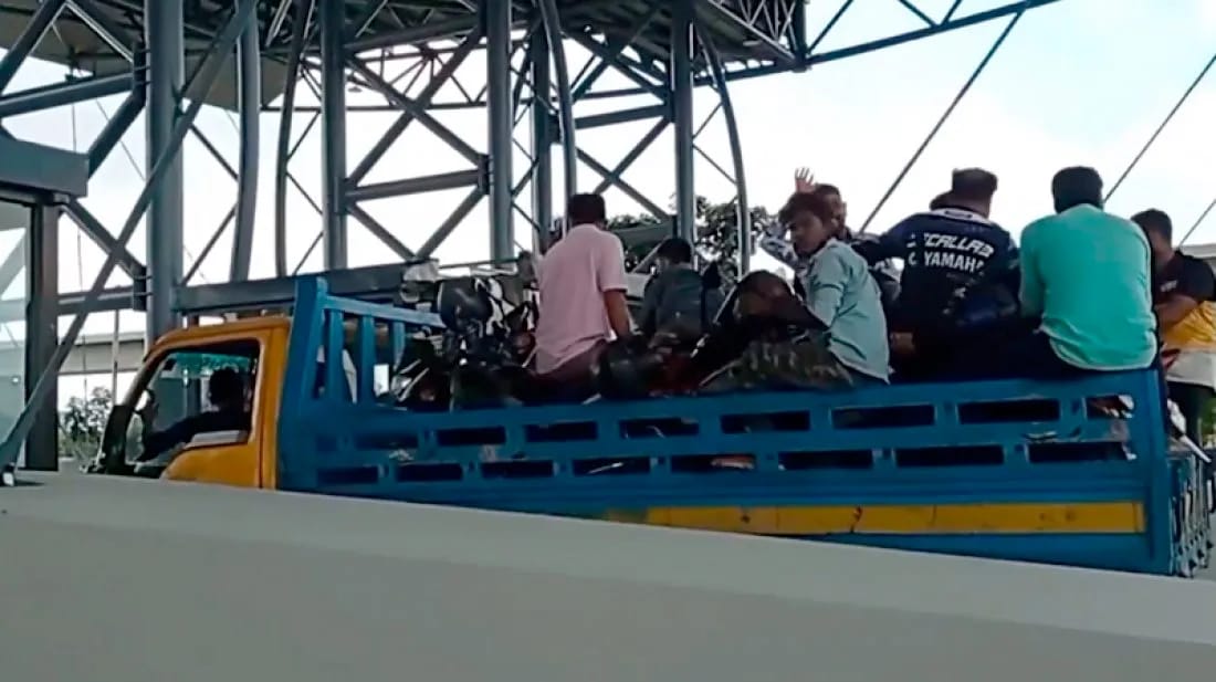 Motorbikes on pickup trucks crossing Padma Bridge