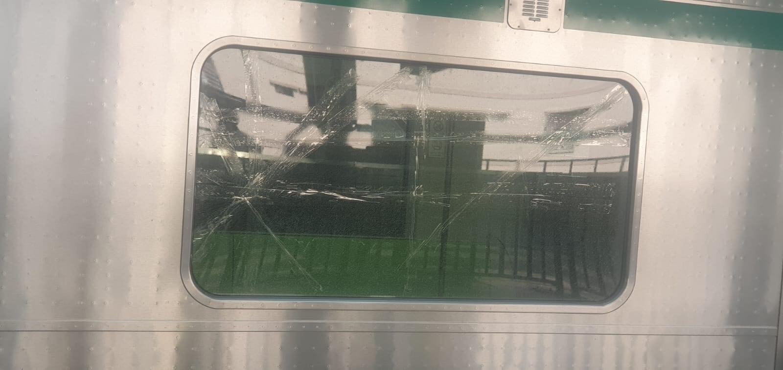 Stone-like object thrown at metro rail; window damaged
