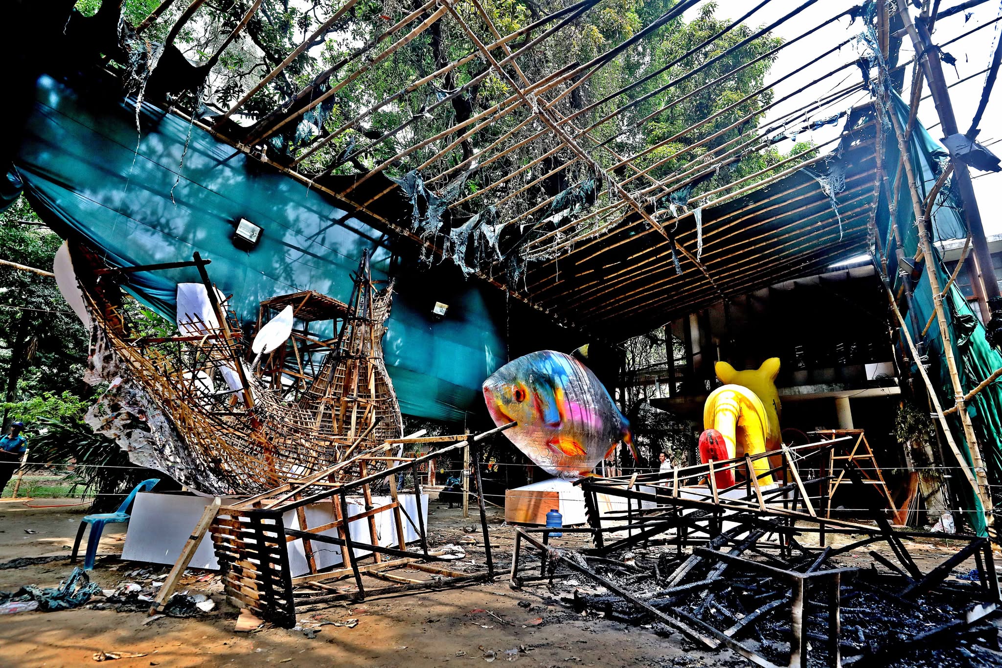 Fire burns ‘Face of Fascism’ and ‘Dove of Peace’ motifs at DU Charukola