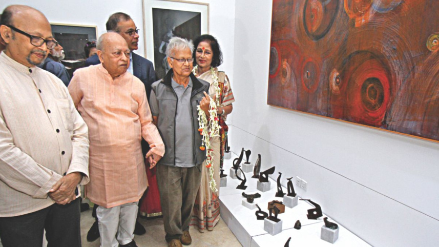 Sculptor Hamiduzzaman Khan and other guests at the exhibition