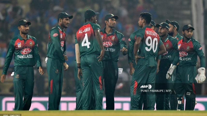 Bangladesh players celebrate after the wicket of Indian batsman Shikhar Dhawan