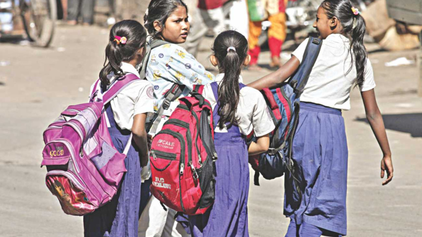 Heavy school bags on delicate shoulders