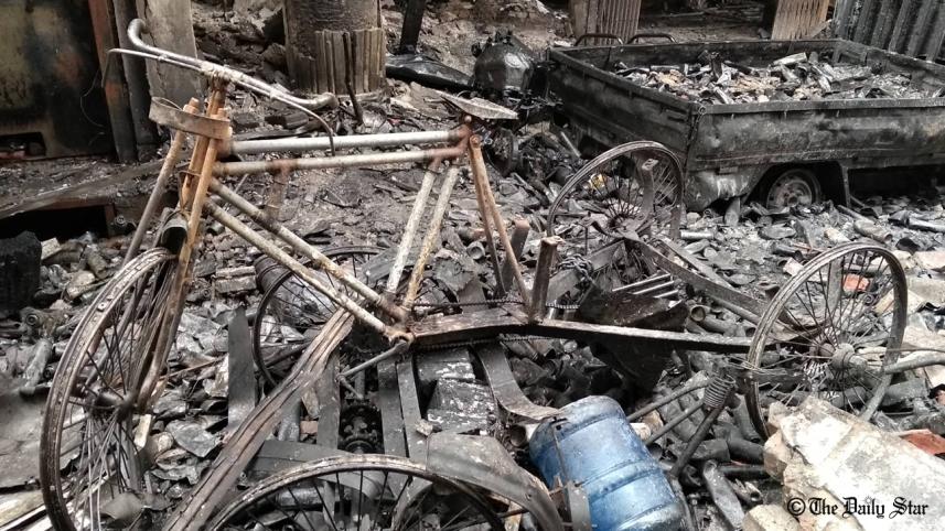 A rickshaw is burnt in Dhaka's Chawkbazar Fire 