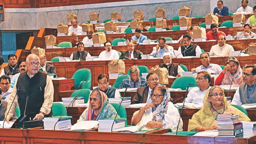 Muhith presents budget.jpg