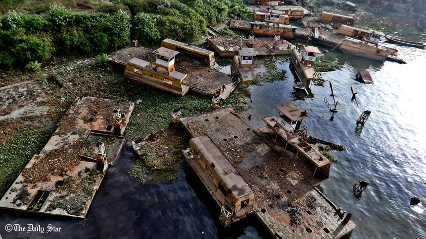 Dilapidated pontoons and ferries float