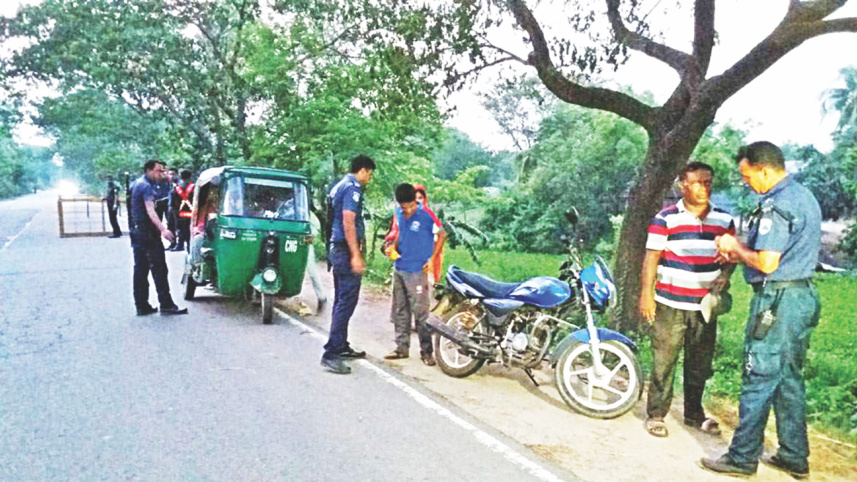 Policemen check vehicles.jpg