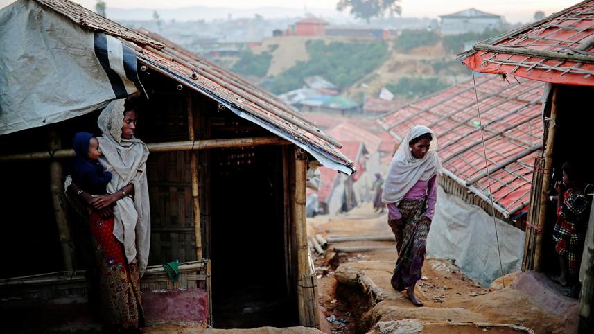 Rohingya refugee women go about their day at the Balukhali camp in Cox's Bazar