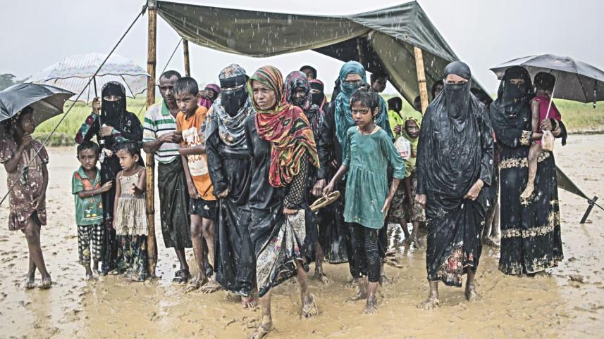 Rohingyas shelter rain.jpg