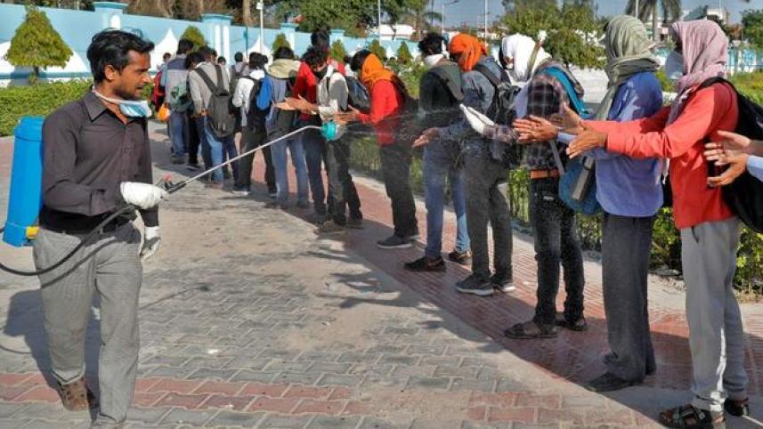 spraying harmful disinfectants on human body