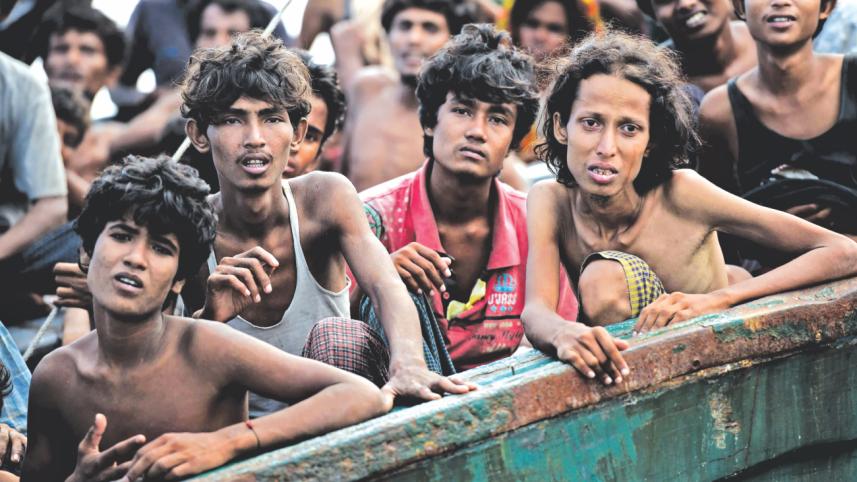 starving migrants boat.jpg