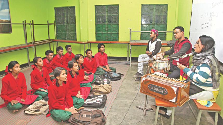 Students learn music at Surer Dhara