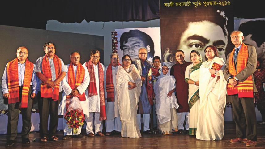 The awardees and guests pose for a group photo