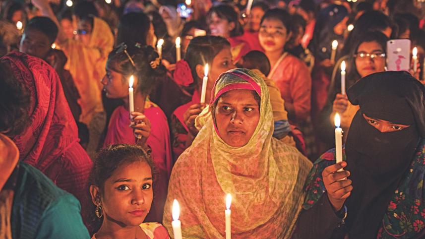 Women hold candles.jpg