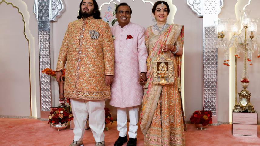 groom_anant_ambani_poses_for_pictures_with_nita_ambani_and_mukesh_ambani_on_the_red_carpet_on_the_day_of_his_wedding_with_radhika_merchant_in_mumbai_india.jpg