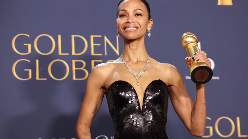 Zoe Saldana poses with the Best Performance by a Female Actor in a Supporting Role in An Motion Picture Award for "Emilia Perez," at the 82nd Golden Globe Awards.jpg