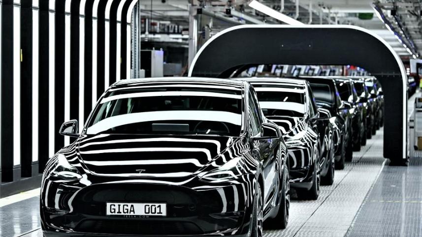 Tesla slashes price.jpg