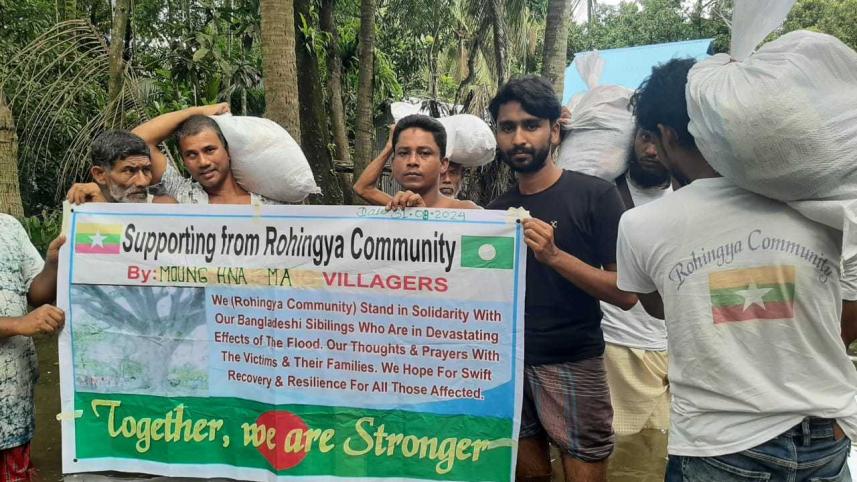 Rohingyas stand beside flood affected people_2d06.jpg