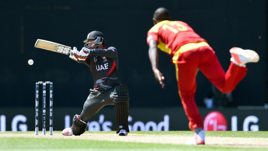 Naveed hits a delivery from Zimbabwe bowler Tendai Chatara