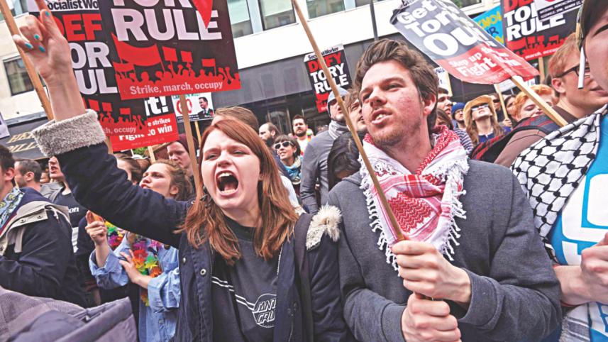 Demonstrators hold placards 3.jpg