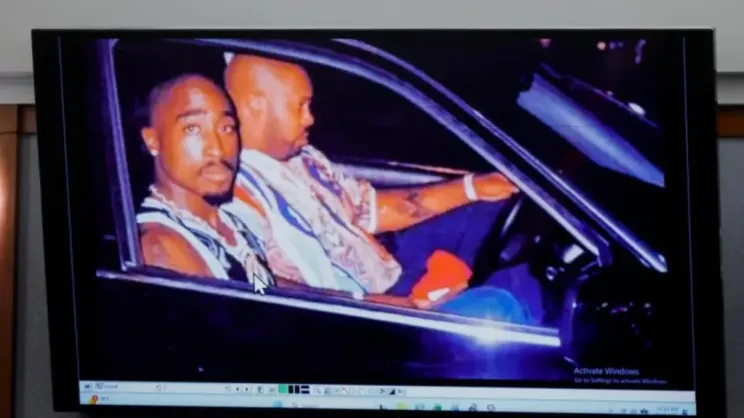 A 1996 photo of rapper Tupac Shakur (L) and Marion "Suge" Knight displayed during the murder trial