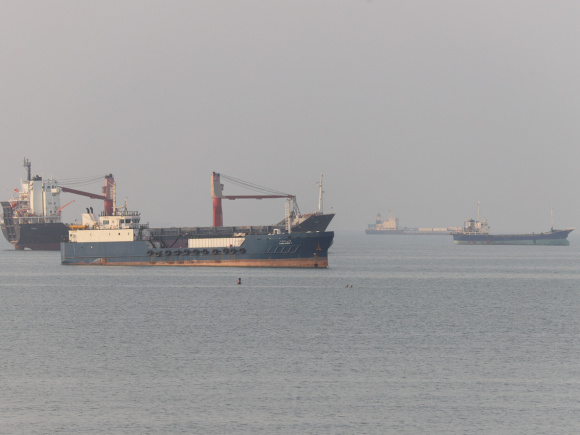 Vessels anchored near the Strait of Hormuz off the coast of Bandar Abbas, Iran, on June 21.jpg