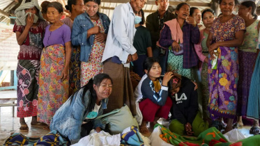 Mourners grieve as bodies are laid out at a cemetery before their burial following a Myanmar military air strike at a hospital that killed more than 30 people in Mrauk U in western Rakhine state on December 11, 2025. More than 100,000 people have been killed across all sides in Myanmar since a military coup five years ago triggered civil war, a conflict monitor said July 1, 2026. Photo: AFP
