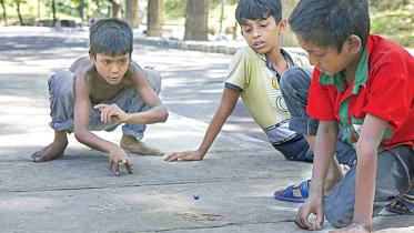 Children playing with marbles 