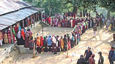 Female voters form a long queue