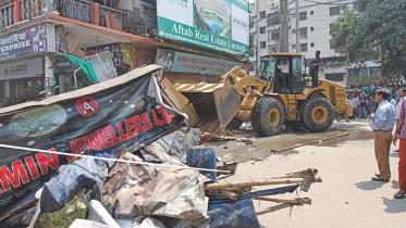 bulldozes illegal structures.jpg