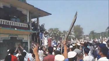 A video grab shows a protester wielding a stick on Sunday