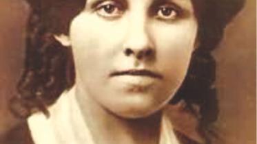LOUISA MAY ALCOTT