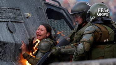 Chilean police officers set on fire