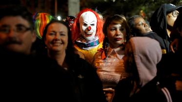 A person dressed in a clown costume