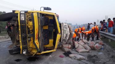truck overturns in Tangail