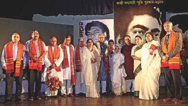The awardees and guests pose for a group photo