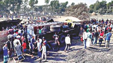 A truck lies on its side after its driver lost control and the vehicle