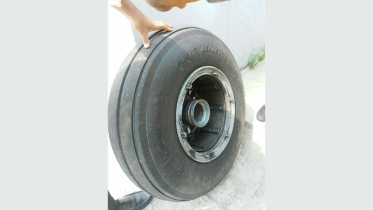 biman flight lands safely after losing wheel