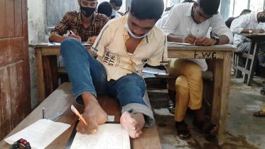 Manik got golden A-plus in SSC examination by writing with foot in Kurigram_d144.jpg