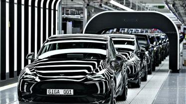 Tesla slashes price.jpg