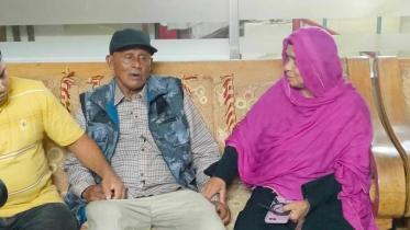 Brac hands over returnee.jpg