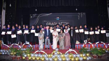 Scholastica graduate ceremony.jpg