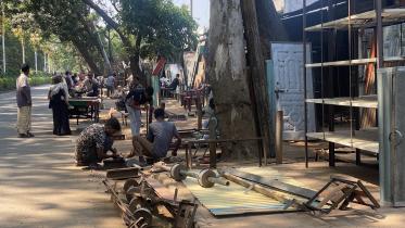 Footpaths in Rajshahi illegally occupied pedestrians forced to walk on roads.jpg