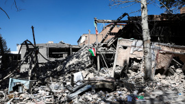 An Iranian flag lies amidst the rubble of a building of the Sharif University of Technology, which was damaged in a strike, amid the U.S.-Israeli conflict with Iran, in Tehran, Iran, April 7, 2026. Photo: Reuters