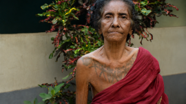 01_Chumki Kisku with her body marking- photo by Samar M Soren.png