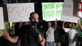 Far-right Israelis protest outside ‘NAZA’ director’s home after Venice win