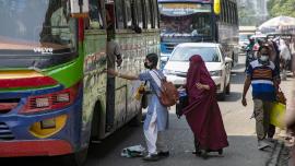 Student getting on a bus.