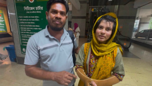 Mehrin Akter with her father Md Salauddin. Photo: Star