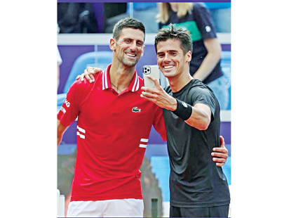 novak-djokovic-with-federico-coria.jpg