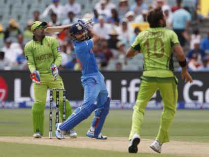 Virat lofts a Aridi ball.JPG